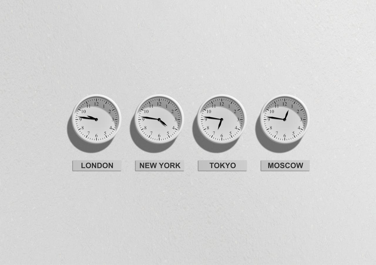 Home Four wall clocks showing different time zones for London, New York, Tokyo, and Moscow.