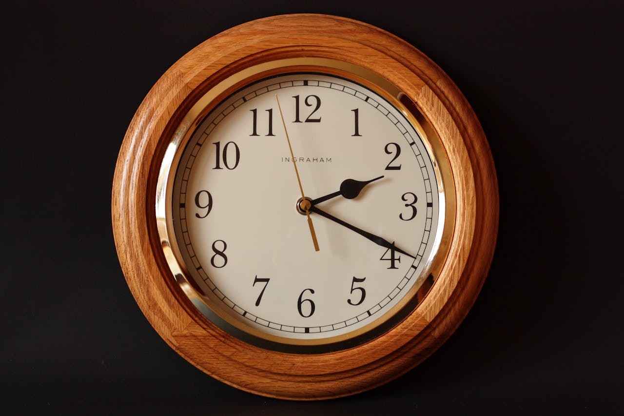 Home A classic wooden wall clock featuring a traditional dial and elegant design, perfect for timeless decor.